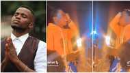"God, I need N400m now now": Video shows young man with candles praying fervently during crossover night