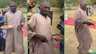 "Food na your mate?" Strong old man dances with plate of jollof rice in his hands, video trends