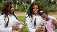 Female graduate almost in tears as adopted sister surprises her with money bouquet on sign-out day