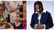 Afro Nation video: "Was he trying to open a champagne bottle with his teeth?" Fans drag Naira Marley online