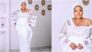 Owanbe ready: Toyin Abraham rocks stunning white lace with asymmetric neckline