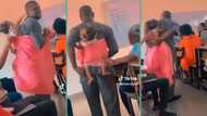 Nigerian lecturer takes baby from female student's arms, backs child in class, video steals hearts