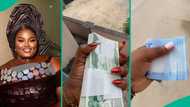 Lady who receives free bundles of cash regularly at workplace speaks about her job in video