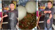 Oyinbo man who sells rice, semo, eba and okro soup amazes people as he interacts with customer in video