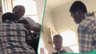 Nigerian man gifts his younger brother new phone, he kneels down to show gratitude