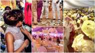 "After 4 years": People attend wedding of lady owing them, pick money guests sprayed her, pay themselves