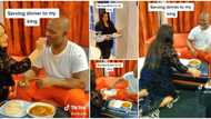 "I need this in my life": Oyinbo lady serves Nigerian husband food like king, kneels & cleans his mouth