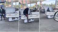 Creative or trash? Reactions trail old video of man driving a coffin ride, he flaunts it at a filling station