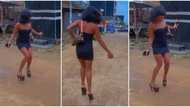 Pretty lady in tight dress struggles to walk in heels, nearly falls in video; many react