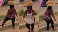 Groundnut seller with perfect shape dances smoothly with tray on her head, sweet video goes viral