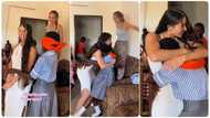 Young girl on blindfold recognizes lady she has not seen in a year, emotional hug melts heart