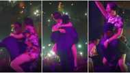 Singer Kizz Daniel carries oyinbo fan like a baby on stage, crowd goes wild, Nigerians react to viral video