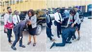 Man who graduated from university years ago prostrates for lecturer in public, touches her feet to show honour