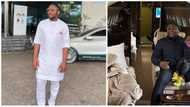 Are you a nanny now? Nigerians drag Ubi Franklin over photo of him carrying Davido's Ifeanyi, he responds