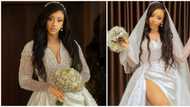 Nigerian bride shows off legs in stylish wedding dress with thigh-high opening