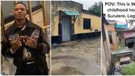 Video shows small Surulere bungalow with peeled paintings, grassy surroundings where Wizkid lived as a child