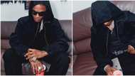 “Rich kid no dey use pouch”: Wizkid’s broken iPhone in his new Christmas photos stirs funny reactions