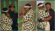 "Your oga won't fire you": Teni goes into crowd, pulls out cameraman on stage and dances with him in video