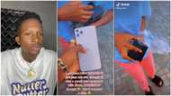 She thought it was a prank: Man buys lady iPhone 11, she opens it with force, phone falls & cracks in video
