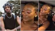 Singer Joeboy helpless as female fan 'cries a river' after getting rare chance to enter his car, record video
