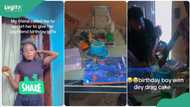 “People dey love”: Lady surprises her boyfriend with cake and framed picture at his parents’ house
