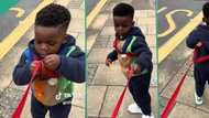 "He doesn't stay one place": Mother uses long rope to restrain her son, funny video trends on TikTok