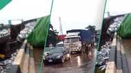 BREAKING: Heavy gridlock as wheat-loaded truck flips on Otedola bridge