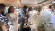 "Beauty is pain": Nigerian bride in unusual wedding gown almost in tears as MC helps her enter car in video