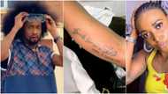 Denrele Edun reacts as relationship blogger Blessing Okoro tattoos his name on her body