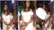 "Do you want or not?" Angry bride looks away from camera as groom puts many rings on her fingers