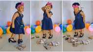 "Small madam": Little girl dances harder as bundles of Naira notes are thrown at her, video goes viral