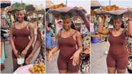 "Boys will buy": Curvy lady dressed in tight playsuit goes to sell agbalumo, video turns heads and goes viral