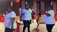 Confident lady with chubby shape dances inside arena with bottle on her head, video goes viral on TikTok