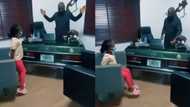 Another level: Nigerian man sighted in Lagos using the boot of Mercedes 200 as office table, many react