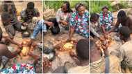 Young men & women dig hole in the ground, eat fufu with soup from it, video causes stir online