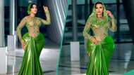 Lady with massive curves slays in gorgeous green dress, gets mixed reactions: "It looks ridiculous"