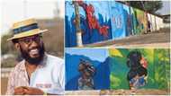 Young man makes fine arts on wall, showcases his skill, people praise him