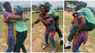 "Mother's love is powerful": Lady visits her son in secondary school, carries him like a baby on her back