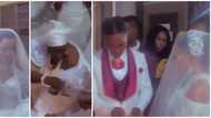Nigerians react to trending video of couple who wedded inside shrine of bride's mother in Delta