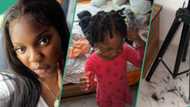 Nigerian mum in tears after entering the room to see her daughter trimming her wig with scissors