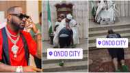 "Na money humble kneel down so": Davido prostrates, kneels as Ondo monarch rains blessings on him