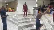 Man "chokes" his pastor with money as he sprays him hard currency on the altar in viral video