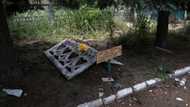 In Ukraine's Siversk, a grave dug on a sidewalk