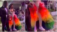 Wedding fashion: Beautiful bride stuns in rainbow-coloured reception dress