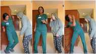 Lady in nurse uniform dances with oyinbo woman during work time, makes her exercise, people talk