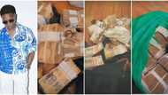Wizkid Flaunts 2 Big Sacks of Naira and Dollar in His Lagos Hotel Room