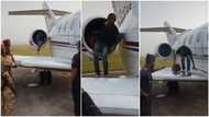 Boy who desperately wants to relocate abroad hides inside aeroplane's engine in video, police catch him