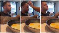 "You can't be useless in my kitchen": Lady breaks egg on her husband's head while cooking, video goes viral