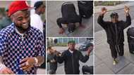 "My Oga na u give me visa": Isreal rings bell on the streets of London, kneels and bows as he thanks Davido