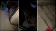 Son opens tap down, gets mum's house heavily flooded, frustrated woman tries to scoop water out in video